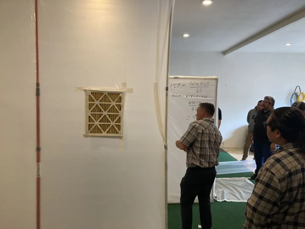 IICRC certified water damage restoration technicians with professional drying and extraction equipment