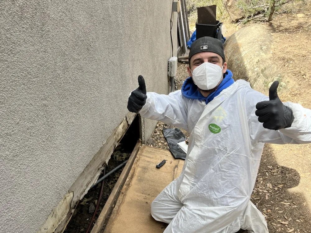 Sewage backup cleanup and sanitization crew in protective gear performing biohazard restoration in Riverside County